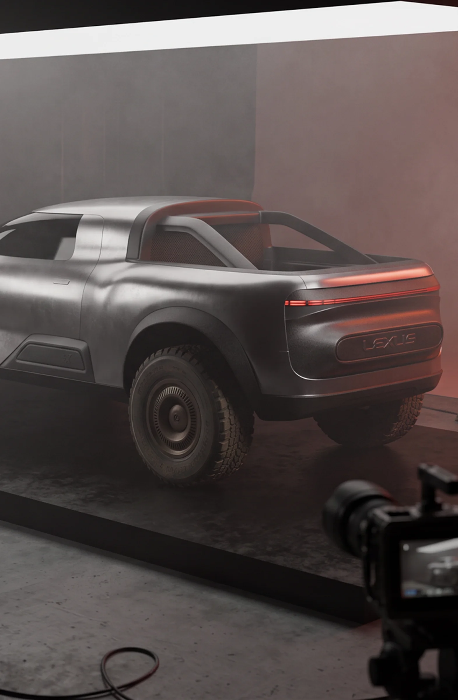 Rear three-quarter view of the Lexus EX off-road concept vehicle on a studio set during a behind-the-scenes photoshoot.
