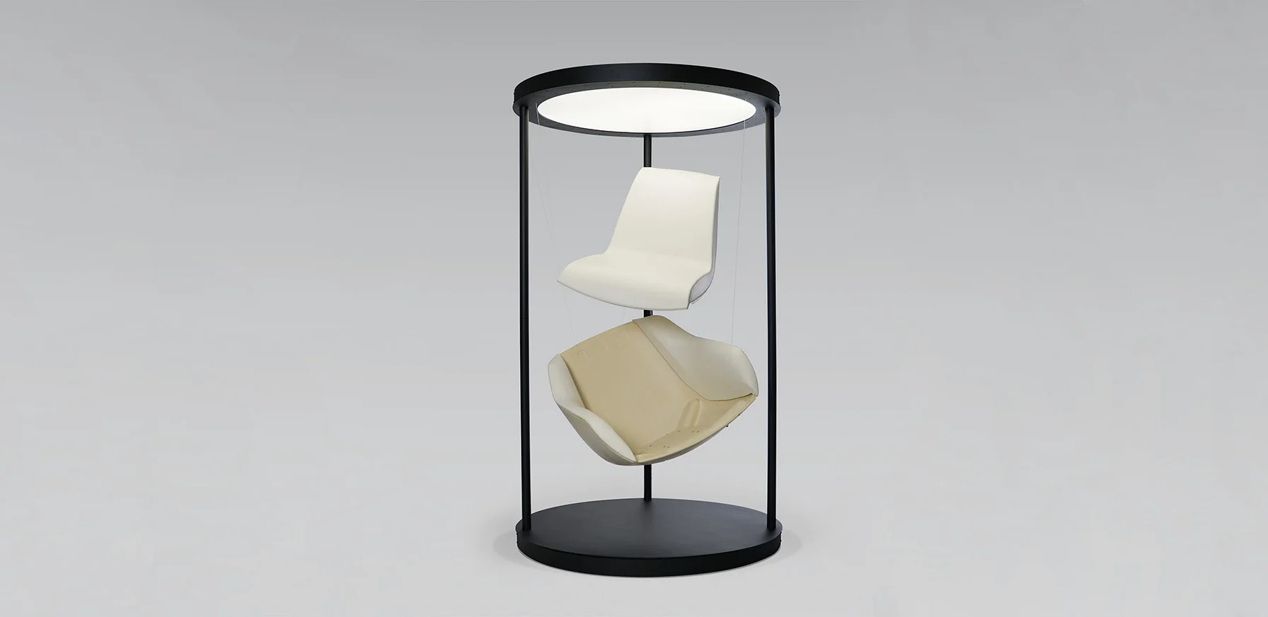 Terra Lounge armchair components suspended within a circular display frame, showing the outer shell and inner foam construction.