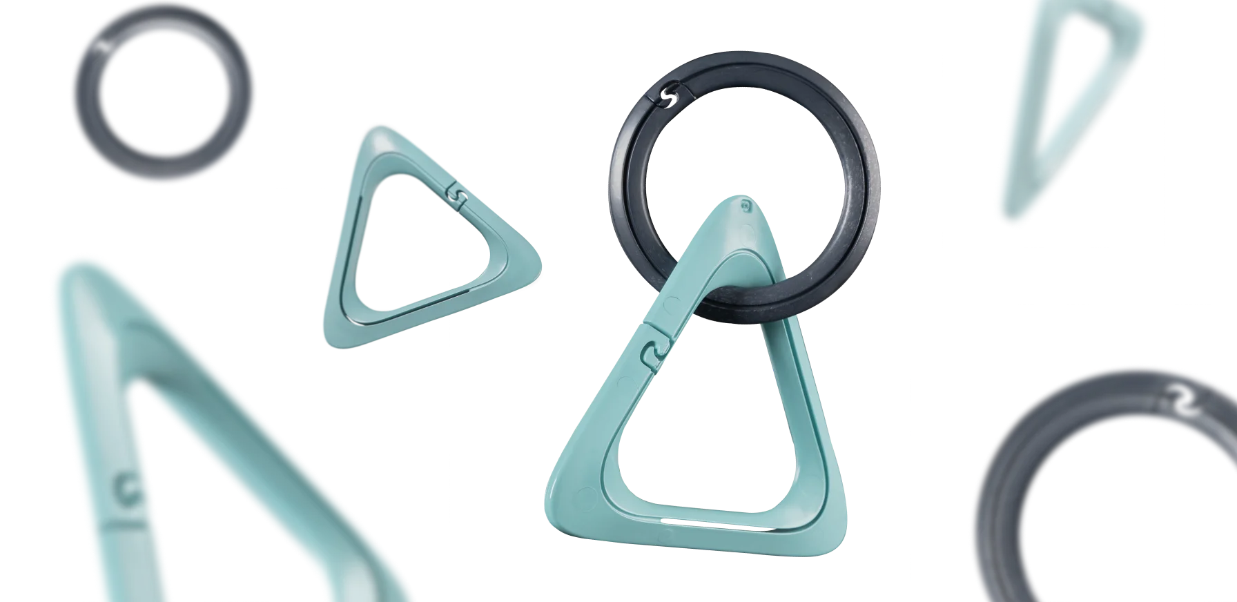 IQOS Turquoise carabiners and Anthracite rings designed for the IQOS Clip Case, shown in different positions and close up details.