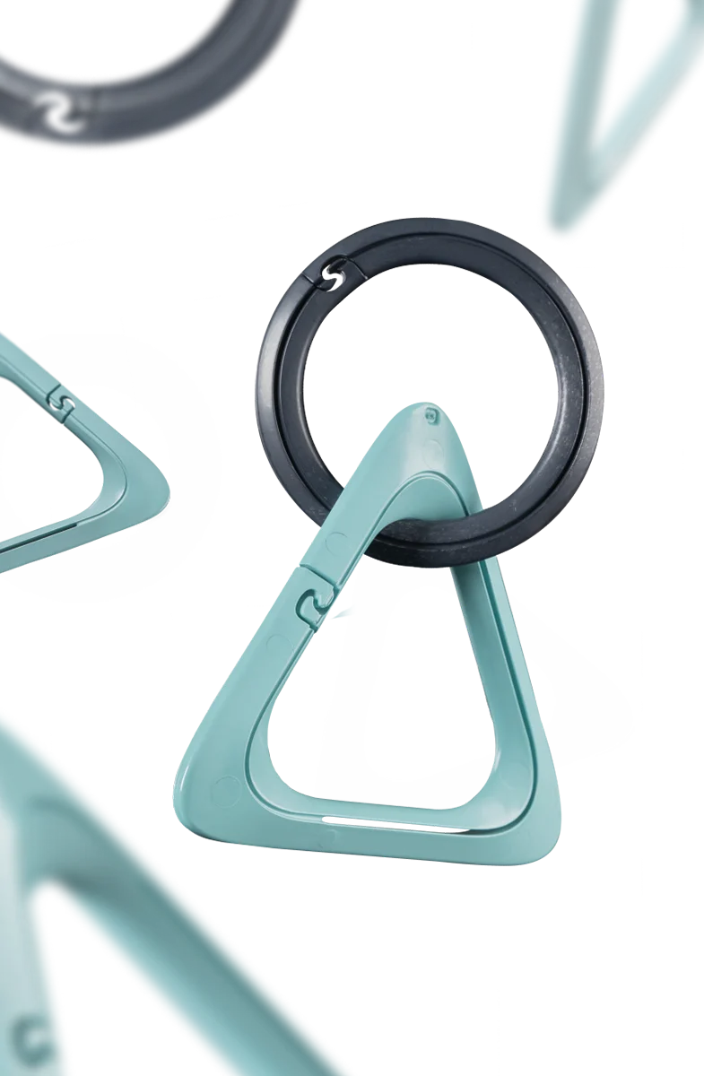 IQOS Turquoise carabiners and Anthracite rings designed for the IQOS Clip Case, shown in different positions and close up details.